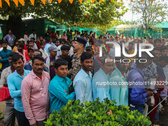 Hindu devotees are waiting in a long queue to pay their obeisance on the occasion of the Raksha Bandhan festival at the Shankaracharya templ...