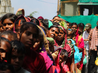 Hindu devotees are waiting in a long queue to pay their obeisance on the occasion of the Raksha Bandhan festival at the Shankaracharya templ...