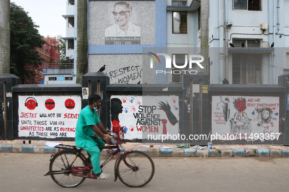 Slogans and graffiti are condemning the rape and murder of a trainee medic at a government-run hospital inside Kolkata Medical College and H...