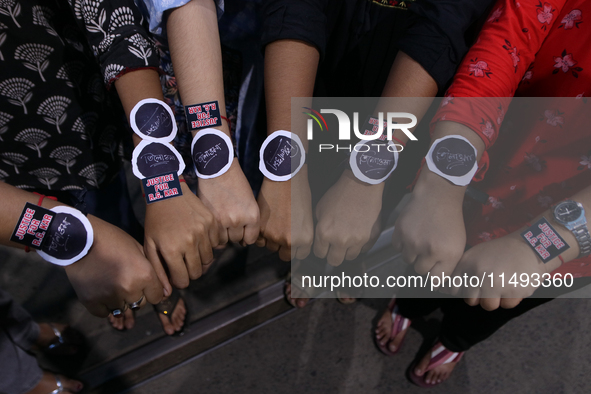 Medical College students are showing 'Rakhis' and printed 'we want justice' during a ceremony of the Raksha Bandhan festival and are strongl...