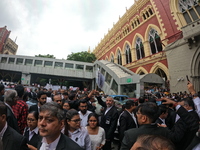 Lawyers of Calcutta High Court are holding posters and participating in a protest rally against the alleged sexual assault and murder of a p...