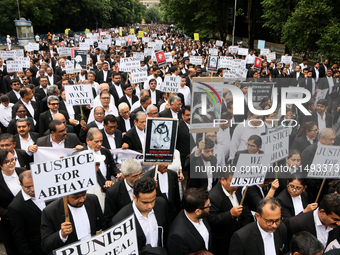 Lawyers of Calcutta High Court are holding posters and participating in a protest rally against the alleged sexual assault and murder of a p...