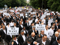 Lawyers of Calcutta High Court are holding posters and participating in a protest rally against the alleged sexual assault and murder of a p...