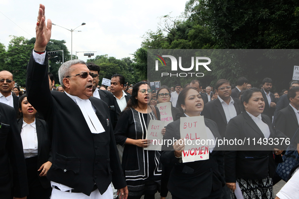 Lawyers of Calcutta High Court are holding posters and participating in a protest rally against the alleged sexual assault and murder of a p...