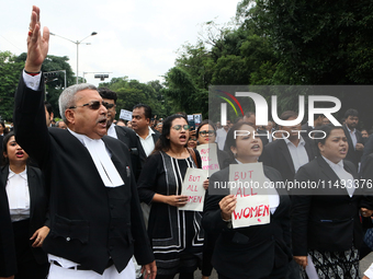 Lawyers of Calcutta High Court are holding posters and participating in a protest rally against the alleged sexual assault and murder of a p...