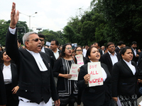 Lawyers of Calcutta High Court are holding posters and participating in a protest rally against the alleged sexual assault and murder of a p...