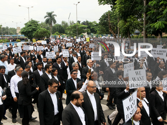 Lawyers of Calcutta High Court are holding posters and participating in a protest rally against the alleged sexual assault and murder of a p...