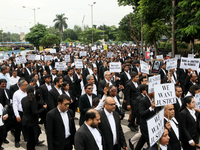 Lawyers of Calcutta High Court are holding posters and participating in a protest rally against the alleged sexual assault and murder of a p...