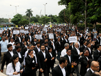 Lawyers of Calcutta High Court are holding posters and participating in a protest rally against the alleged sexual assault and murder of a p...