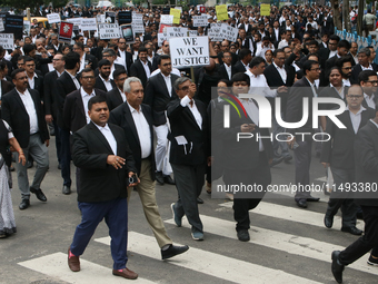 Lawyers of Calcutta High Court are holding posters and participating in a protest rally against the alleged sexual assault and murder of a p...