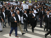 Lawyers of Calcutta High Court are holding posters and participating in a protest rally against the alleged sexual assault and murder of a p...