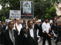 Lawyers of Calcutta High Court are holding posters and participating in a protest rally against the alleged sexual assault and murder of a p...