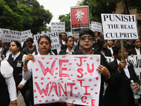 Lawyers of Calcutta High Court are holding posters and participating in a protest rally against the alleged sexual assault and murder of a p...