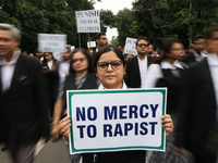 Lawyers of Calcutta High Court are holding posters and participating in a protest rally against the alleged sexual assault and murder of a p...