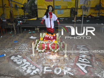 A clay statue of a doctor depicting a victim of rape and murder is being pictured at a protest site in Kolkata, India, on August 19, 2024. (