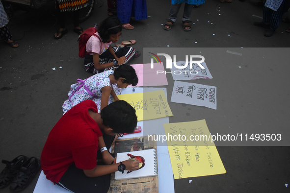 Children are painting and making posters to condemn the rape and murder of a trainee medic at a government-run hospital, in Kolkata, India,...