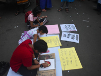 Children are painting and making posters to condemn the rape and murder of a trainee medic at a government-run hospital, in Kolkata, India,...