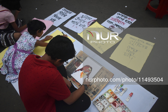 Children are painting and making posters to condemn the rape and murder of a trainee medic at a government-run hospital, in Kolkata, India,...