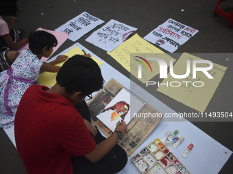 Children are painting and making posters to condemn the rape and murder of a trainee medic at a government-run hospital, in Kolkata, India,...