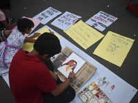 Children are painting and making posters to condemn the rape and murder of a trainee medic at a government-run hospital, in Kolkata, India,...