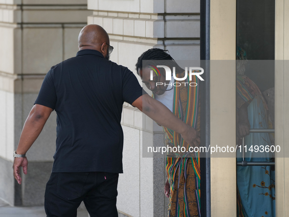 District of Columbia Councilman Trayon White, Sr., center, walks out of the federal courthouse after his initial appearance, Monday, Aug. 19...