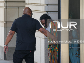 District of Columbia Councilman Trayon White, Sr., center, walks out of the federal courthouse after his initial appearance, Monday, Aug. 19...