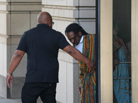 District of Columbia Councilman Trayon White, Sr., center, walks out of the federal courthouse after his initial appearance, Monday, Aug. 19...