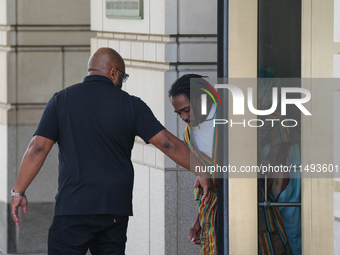 District of Columbia Councilman Trayon White, Sr., center, walks out of the federal courthouse after his initial appearance, Monday, Aug. 19...