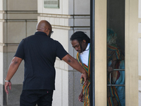 District of Columbia Councilman Trayon White, Sr., center, walks out of the federal courthouse after his initial appearance, Monday, Aug. 19...