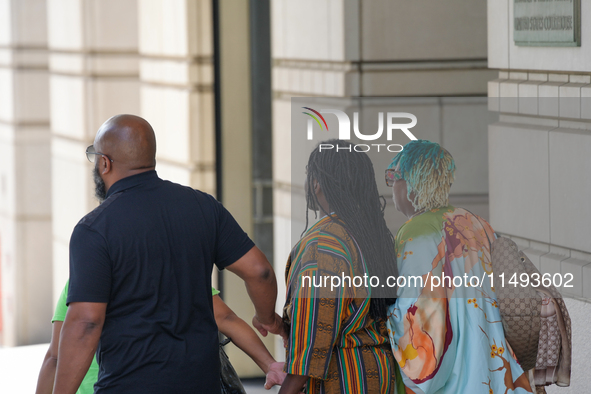 District of Columbia Councilman Trayon White, Sr., center, walks out of the federal courthouse after his initial appearance, Monday, Aug. 19...