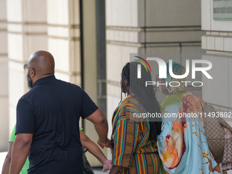 District of Columbia Councilman Trayon White, Sr., center, walks out of the federal courthouse after his initial appearance, Monday, Aug. 19...