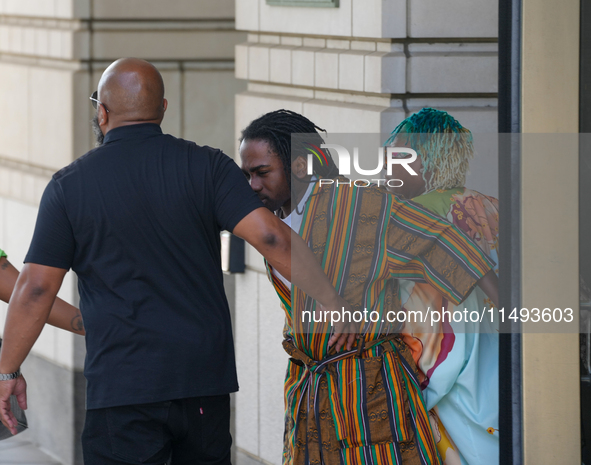 District of Columbia Councilman Trayon White, Sr., center, walks out of the federal courthouse after his initial appearance, Monday, Aug. 19...