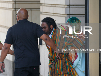 District of Columbia Councilman Trayon White, Sr., center, walks out of the federal courthouse after his initial appearance, Monday, Aug. 19...