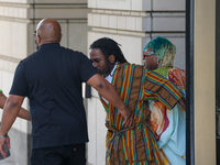 District of Columbia Councilman Trayon White, Sr., center, walks out of the federal courthouse after his initial appearance, Monday, Aug. 19...