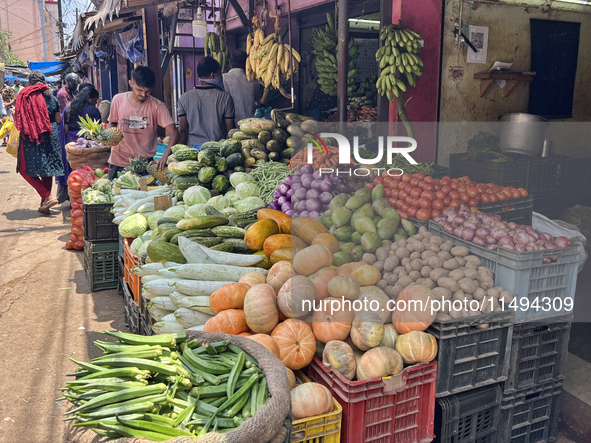 People are purchasing fruits and vegetables at the Chalai market in Thiruvananthapuram, Kerala, India, on April 13, 2024. The Chalai Market...