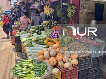 People are purchasing fruits and vegetables at the Chalai market in Thiruvananthapuram, Kerala, India, on April 13, 2024. The Chalai Market...