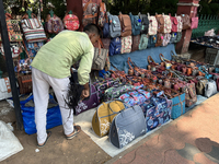 A man is selling bags and handbags along the footpath in Thiruvananthapuram (Trivandrum), Kerala, India, on April 01, 2024. (