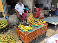 A man is selling mangoes and lemons at the Chalai market in Thiruvananthapuram, Kerala, India, on April 13, 2024. The Chalai Market (Chalai...