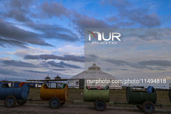 Cattle, horses, and camels are foraging on the grassland in Hulunbuir, China, on August 19, 2024. 