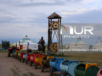 Cattle, horses, and camels are foraging on the grassland in Hulunbuir, China, on August 19, 2024. (