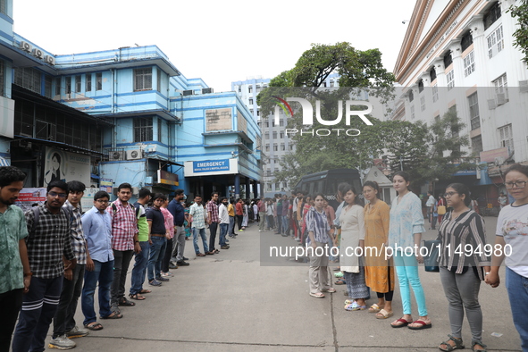 Medical students and doctors are making a human chain during a protest against the rape and murder of a PGT woman doctor at Government-run R...