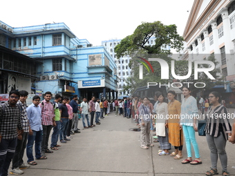 Medical students and doctors are making a human chain during a protest against the rape and murder of a PGT woman doctor at Government-run R...