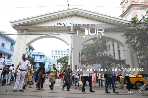 Medical students and doctors are making a human chain outside the National Medical College & Hospital in a protest against the rape and murd...