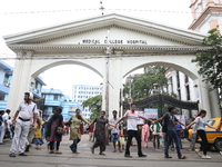 Medical students and doctors are making a human chain outside the National Medical College & Hospital in a protest against the rape and murd...