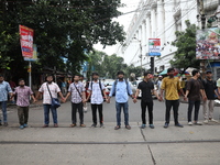 Medical students and doctors are making a human chain during a protest against the rape and murder of a PGT woman doctor at Government-run R...