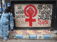 A junior doctor is painting slogans inside National Medical College & Hospital in Kolkata, India, on August 19, 2024, as a protest against t...