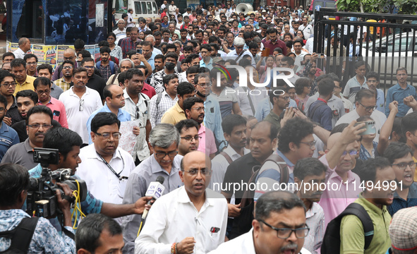 Medical students and doctors are attending a protest rally against the rape and murder of a PGT woman doctor at Government-run R G Kar Medic...