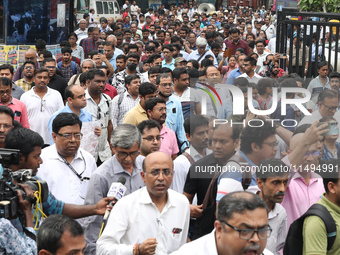 Medical students and doctors are attending a protest rally against the rape and murder of a PGT woman doctor at Government-run R G Kar Medic...