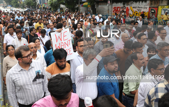 Medical students and doctors are attending a protest rally against the rape and murder of a PGT woman doctor at Government-run R G Kar Medic...