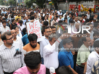 Medical students and doctors are attending a protest rally against the rape and murder of a PGT woman doctor at Government-run R G Kar Medic...